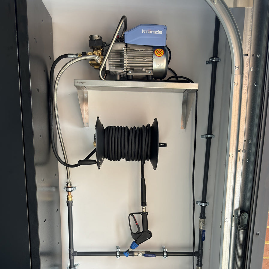 karnal k10 pressure washer on shelf in garage